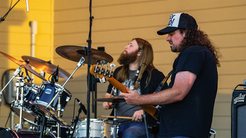 guy playing the guitar on the levitt stage